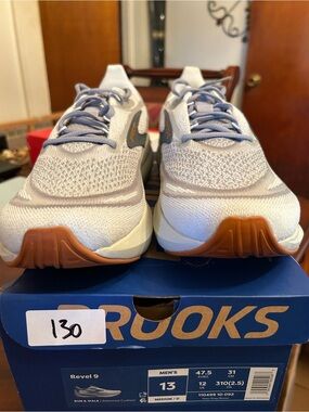 Men’s Brooks light gray and blue knit running shoes with gum outsole